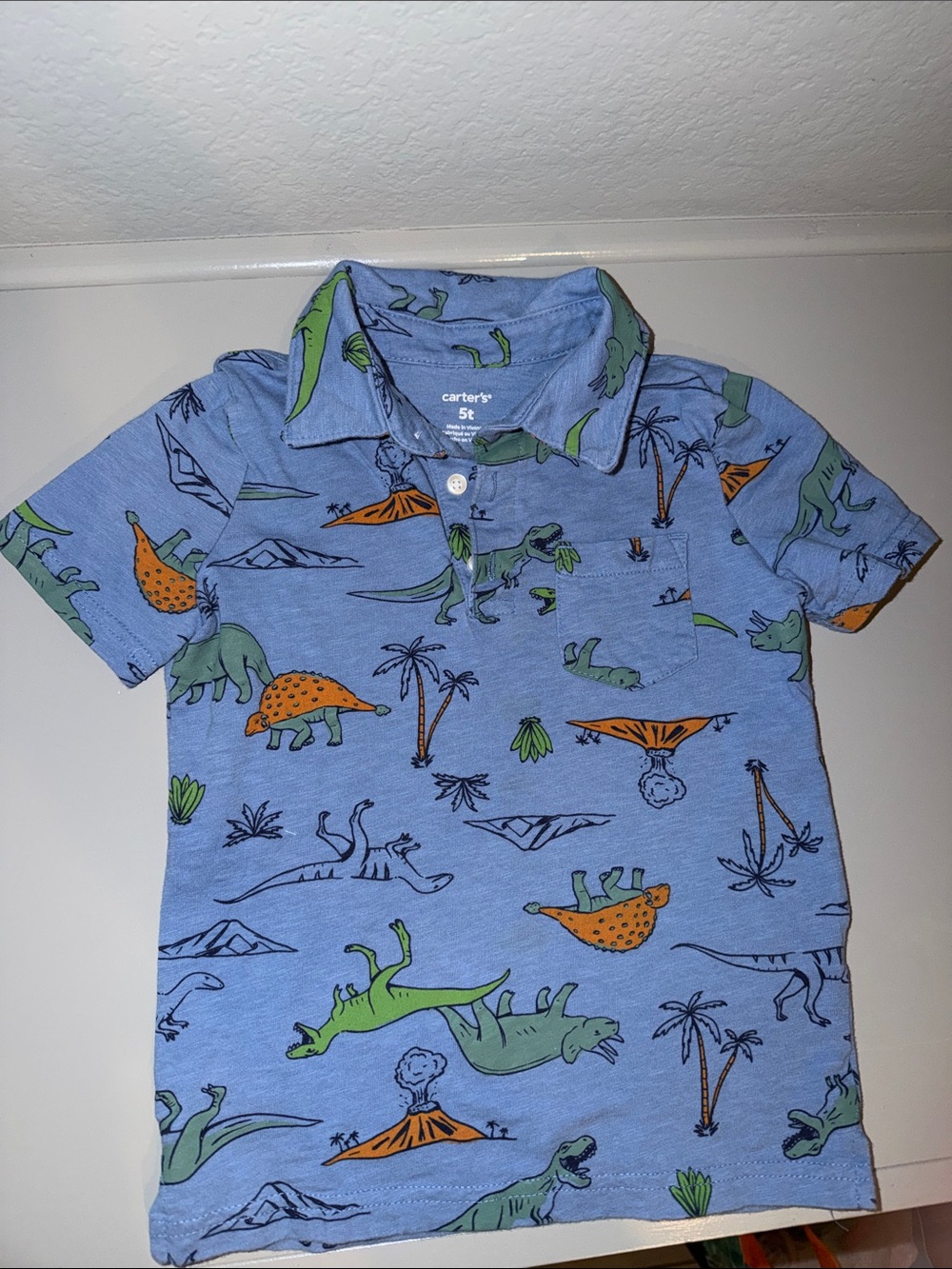 Carter's Light Blue Polo with Green and Orange Dinosaur Prints